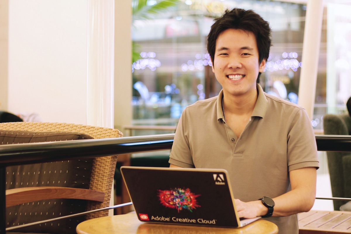 Teerasej at coffee shop and creative cloud macbook